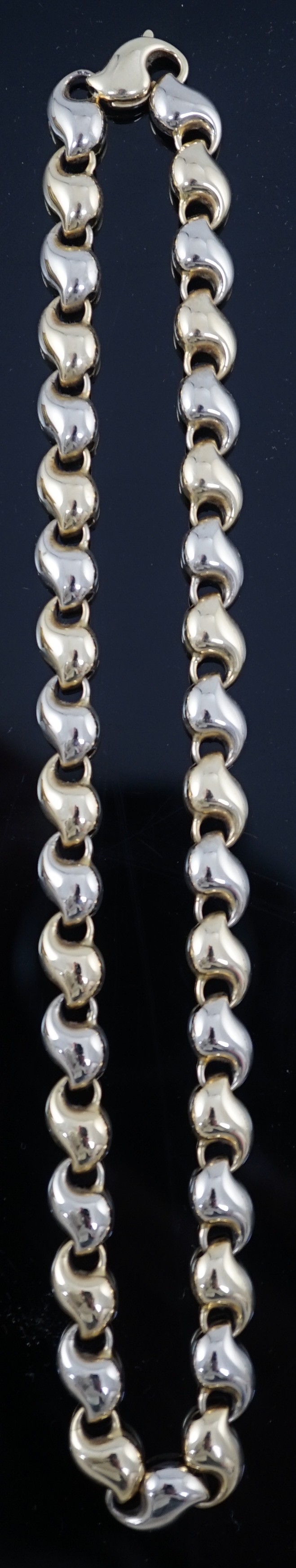 An 18ct two colour gold shaped link necklace